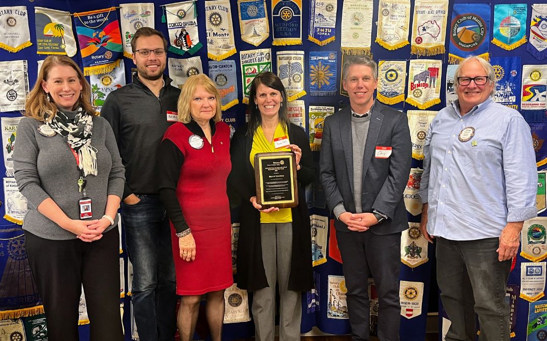 Karen Cotch, Executive Director, and Chris Chambs, Board Chair, are pictured with past presidents of the Golden Valley Rotary Club.